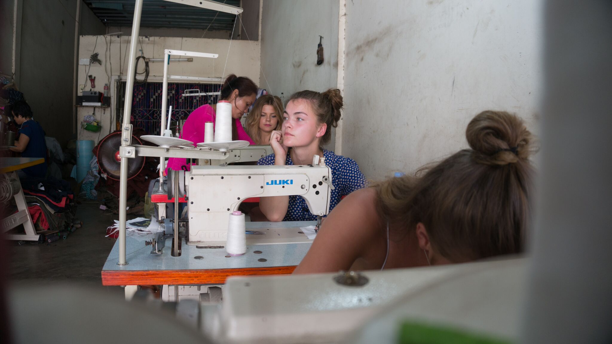 Frida working on sewing machine