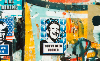 A poster with Mark Zuckerburg's face and the words "You've been Zucked" is glued on a wall covered in graffiti.