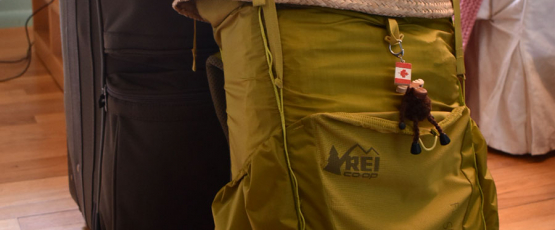 A backpack meant for hiking is loaded to the brim