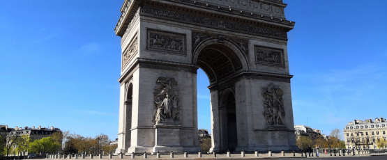 The Arc de Triomphe in Paris, usually a bustling roundabout, stands empty of cars