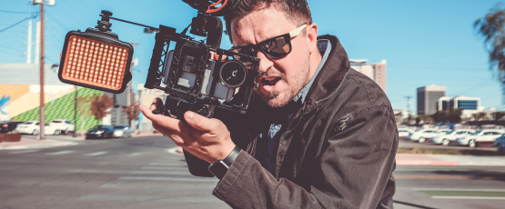 Man filming, Image Credit: NeONBRAND on Unsplash