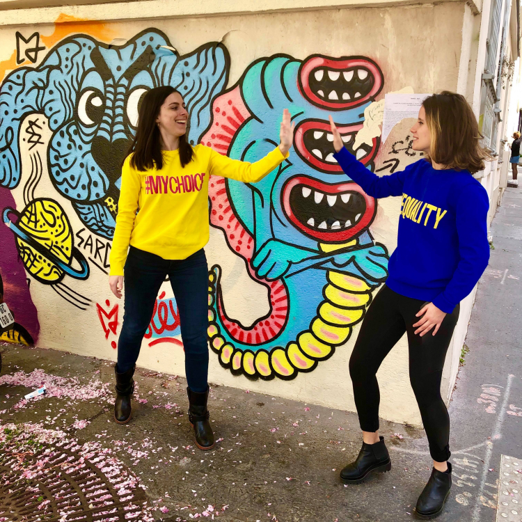 Feminists of Paris Co-Founders Cécile and Julie High-Five